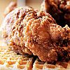 Gussie's Chicken and Waffles logo